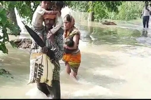 Bihar: Man Walks For 8km In Knee-Deep Flood Water Carrying Ill Kids On Shoulders