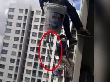 Video: Workers in Thailand left dangling from 26th floor after woman cuts rope