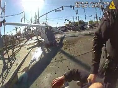 Caught on camera: Pilot rescued from debris of crashed jet in LA moments before train hits