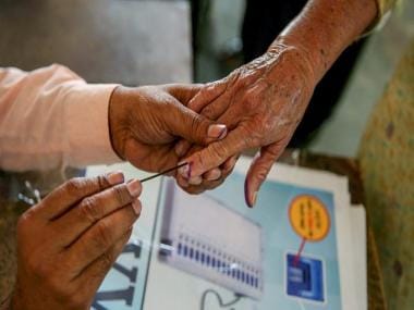 Watch: UP Police constable carries elderly woman to polling station to help cast vote, wins hearts