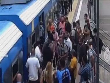 Watch: Woman narrowly escapes death after falling under moving train in Argentina