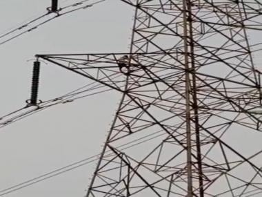 Watch: Man climbs electric tower after wife refuses to come with him
